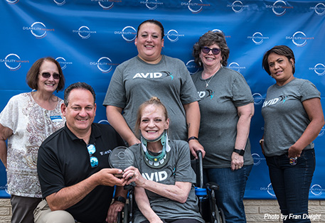 group of Whirlpool Corp/AVID volunteers posed with award