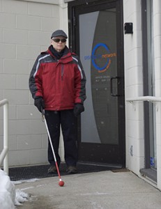 blind man using a white cane