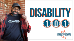 A Black man wearing glasses and a black #DWord shirt that reads Disability is not a bad word. DNSWM logo. Text: Disability 101.