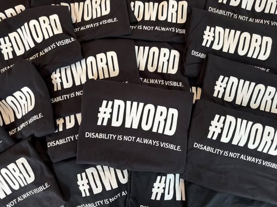 A collection of black shirts with white writing that say #DWord.