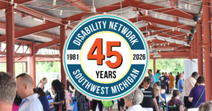 Circular logo celebrating 45 years of Disability Network Southwest Michigan from 1981 to 2026. A bold orange "45" is in the center. In the background, a group of people visiting the Farmers Market.
