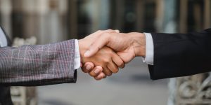 Image of people shaking hands.