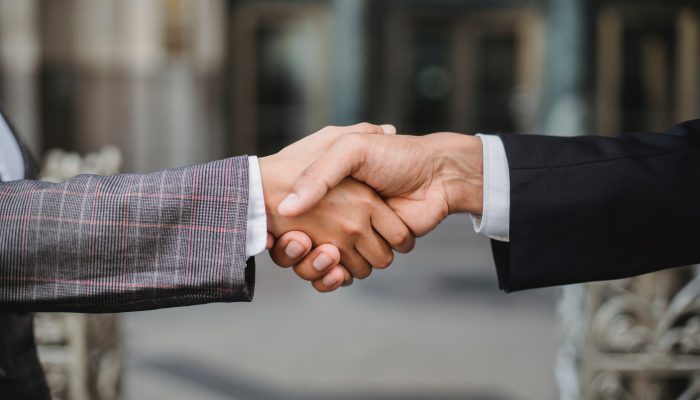 Image of people shaking hands.